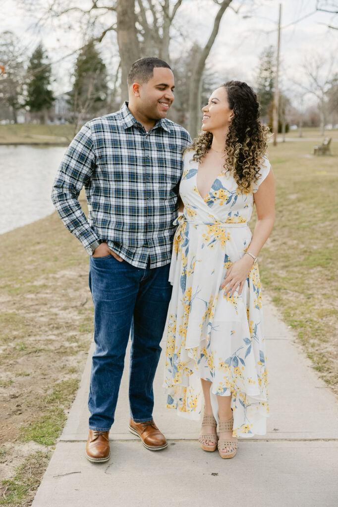 Man and women walking in park in Spring Lake New Jersey for engagement session photos by Simone Jaramillo Photography