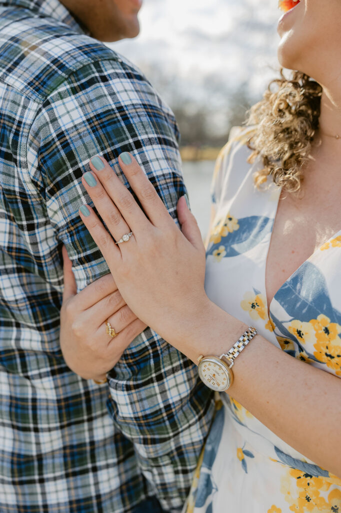 Man and women show off engagement ring in Spring Lake New Jersey for engagement session photos by Simone Jaramillo Photography
