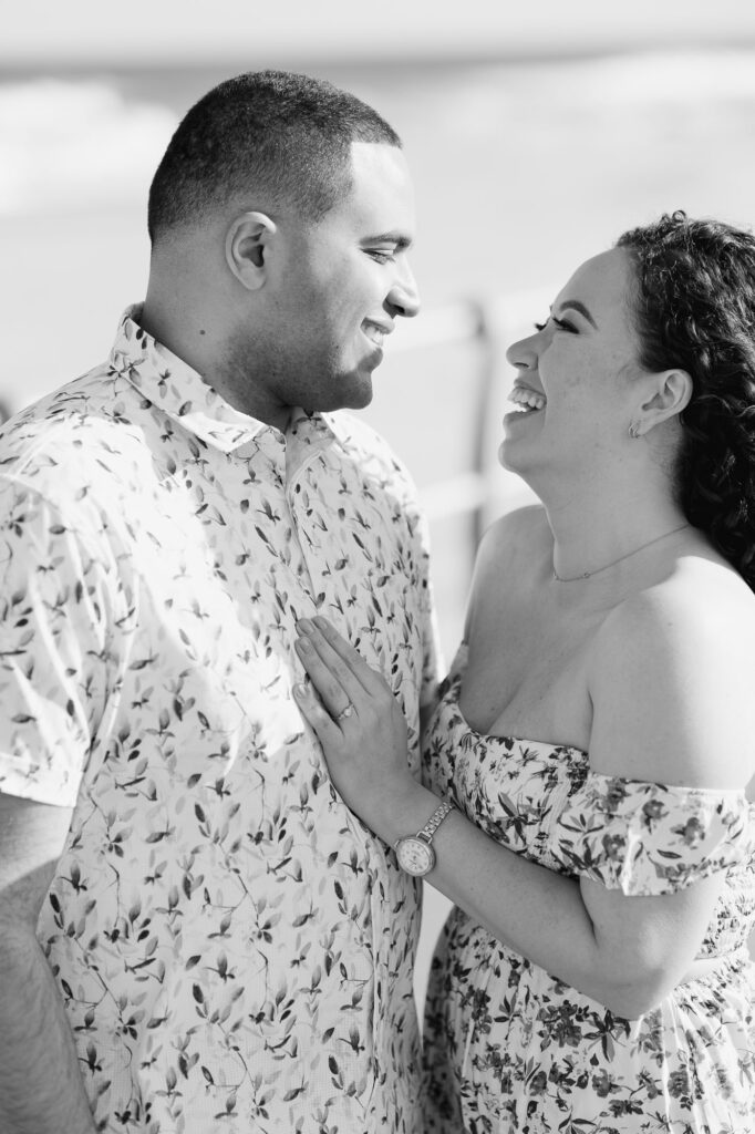 Man and women posing and laughing towards one another.  Photos taken by Simone Jaramillo Photography