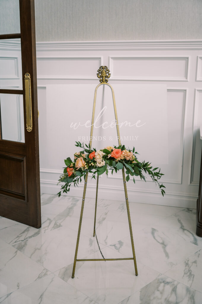 welcome sign with floral design in the entrance of The Mill Lakeside Manor