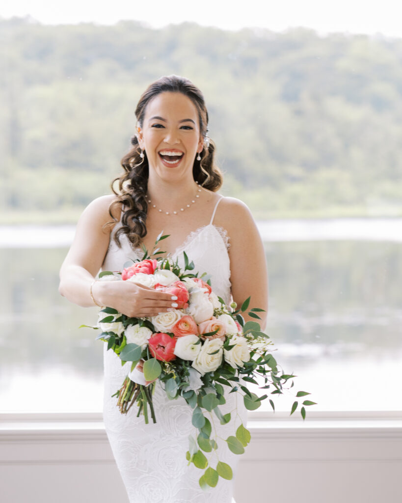 Bridal portrait with bouquet in getting ready suit at the Mill at Lakeside Manor
