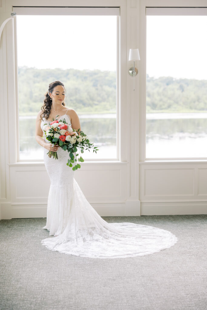 Bridal portrait with bouquet in getting ready suit at the Mill at Lakeside Manor
