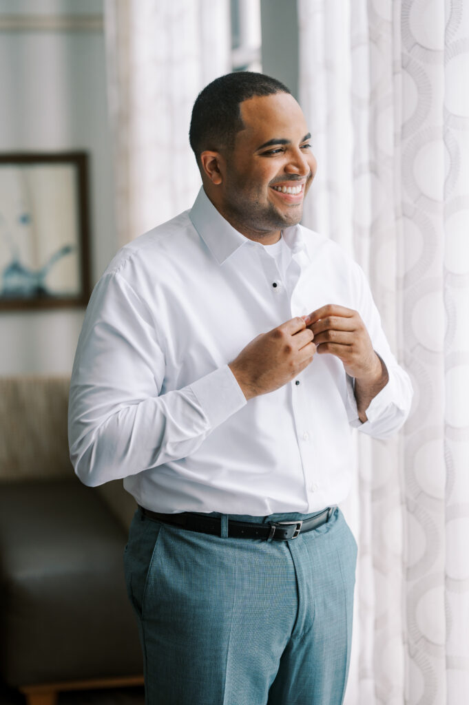 groom getting ready in hotel for new jersey summer wedding