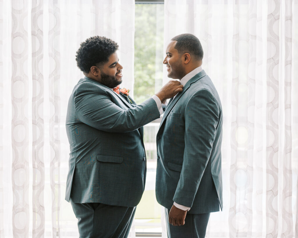 groom getting ready with groomsman