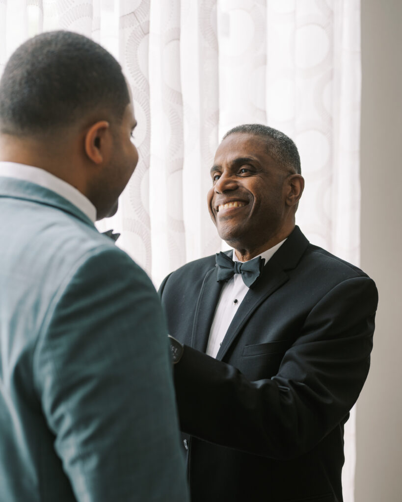 groom getting ready with groomsman