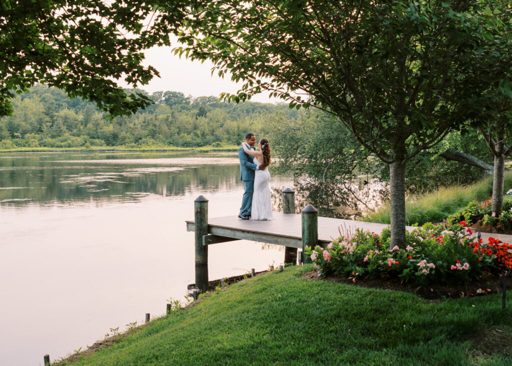 couple dancing on the dock at their The Mill Lakeside Manor wedding