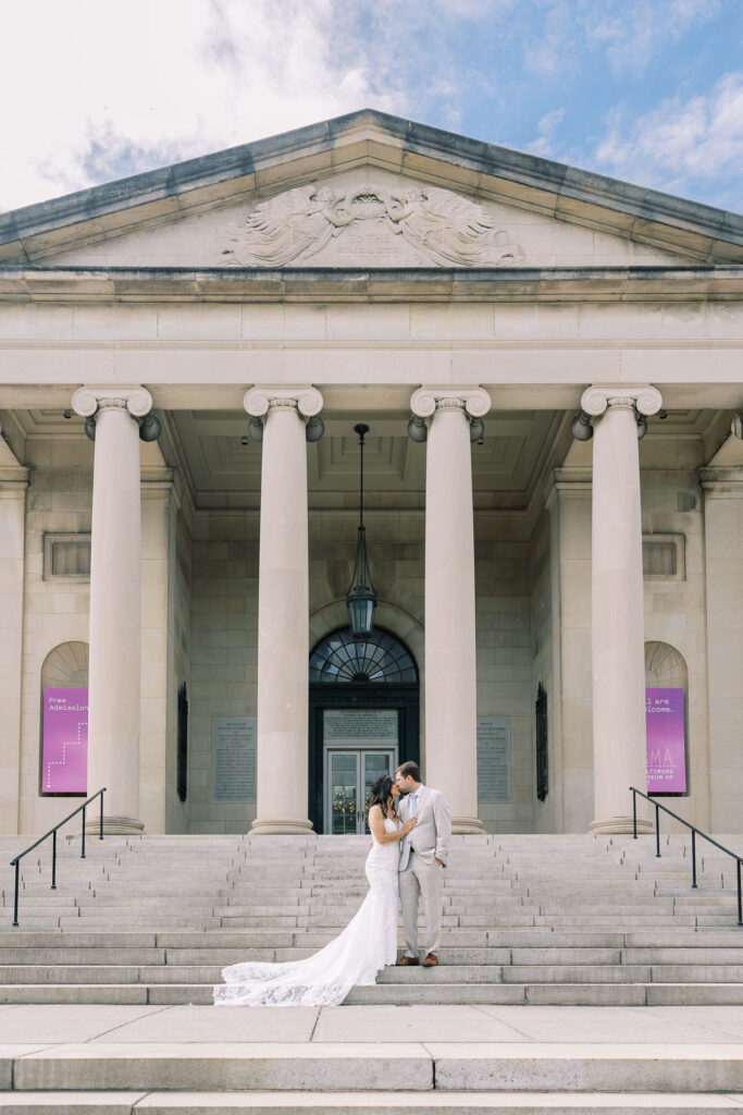 couple shares kiss on steps of baltimore museum of arts