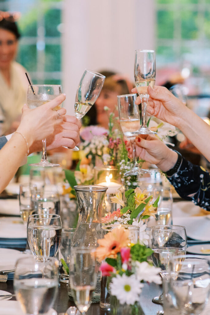 Wedding guest cheers after toast