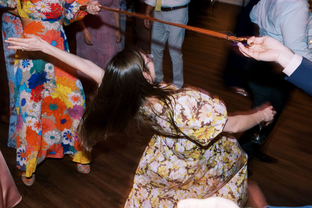 Wedding guest limbo at reception