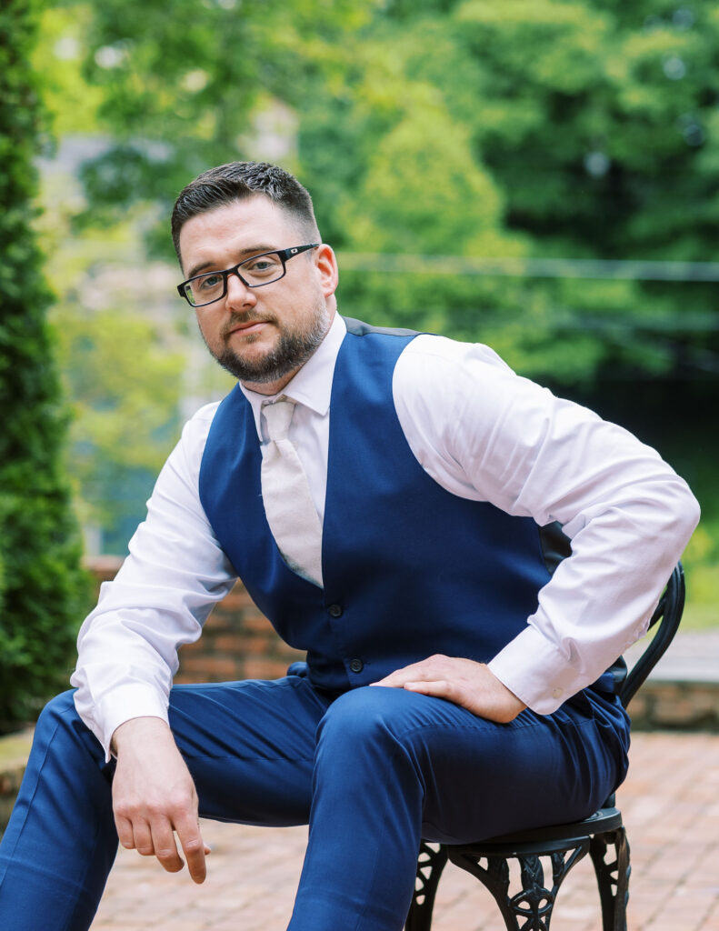 Groom portrait while sitting on chair