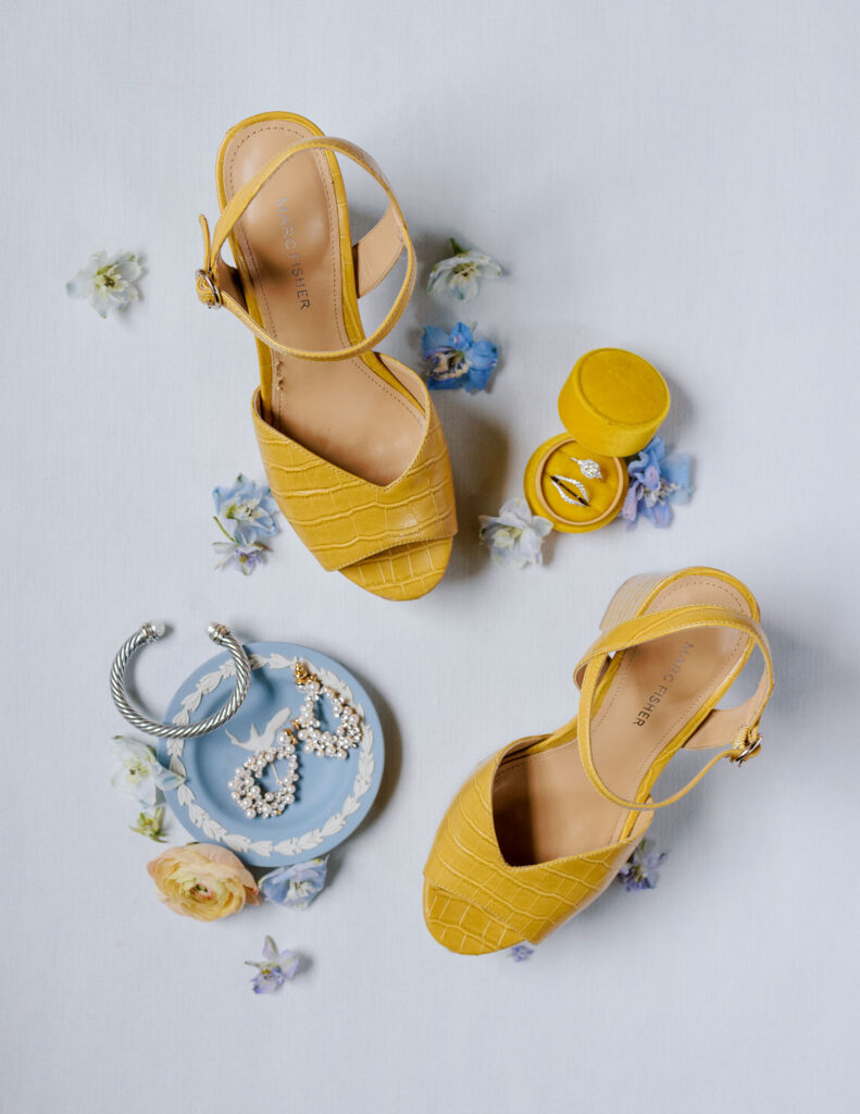 Bridal details of Marc fisher heels in yellow with brides jewelry