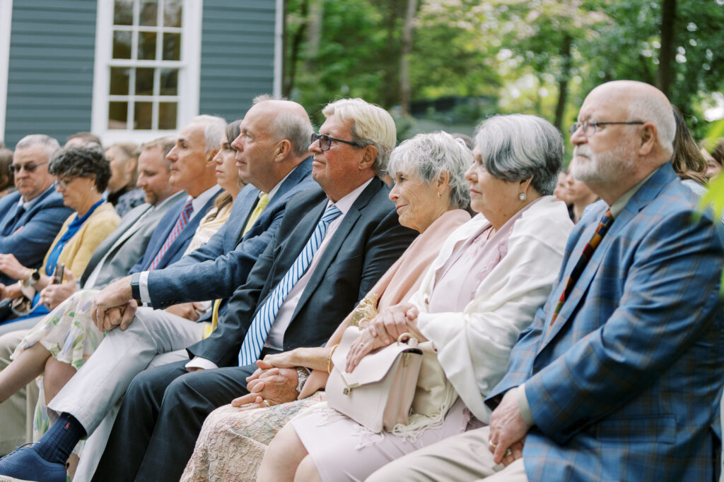 Wedding guest watching ceremony