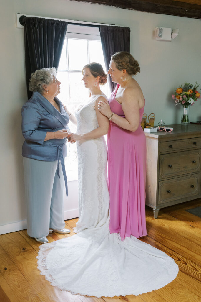 Mom and sister help bride get ready