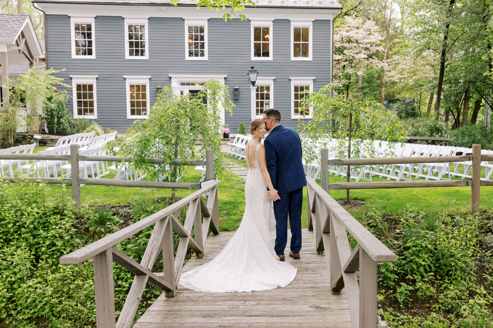 Bride and Groom on bridge, Milllrace Pond Wedding in the lawn area, best wedding photography in new jersey