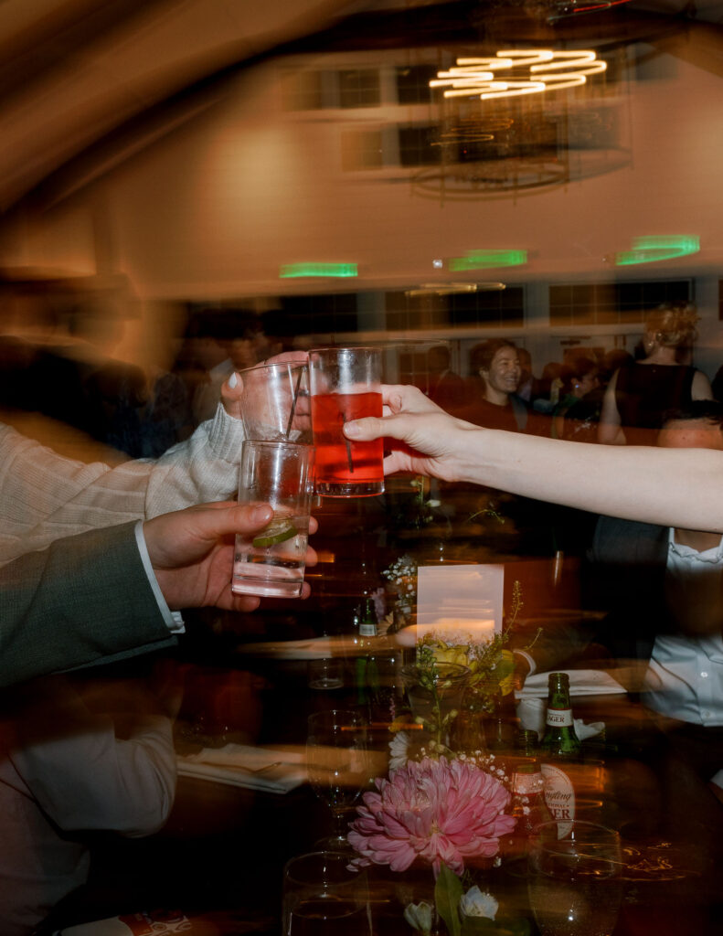 Wedding guest cheersing glasses