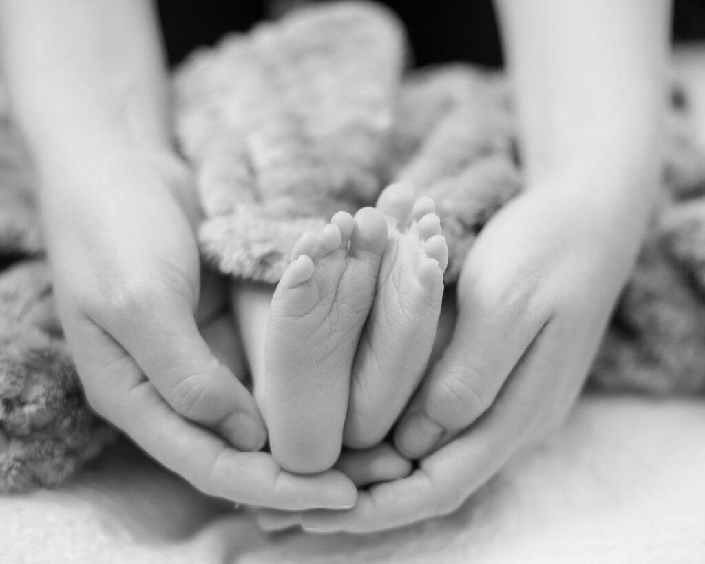 tiny newborn feet during in home family photo session located in reno nevada. 