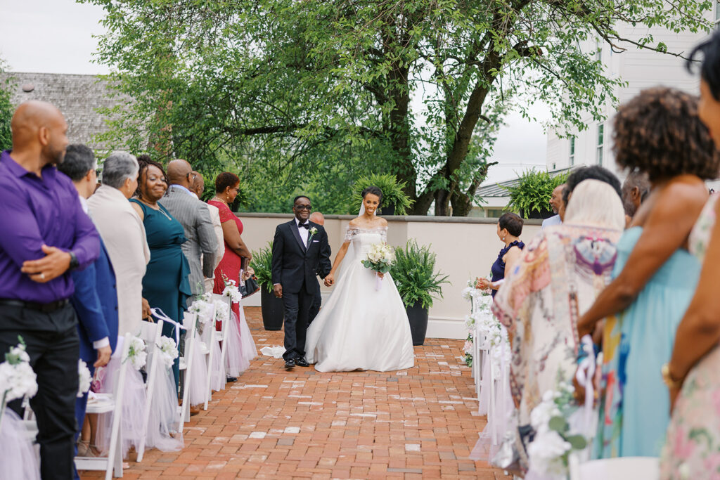Father and bride walking down the aisle for the ceremony at a Outdoor wedding in NJ