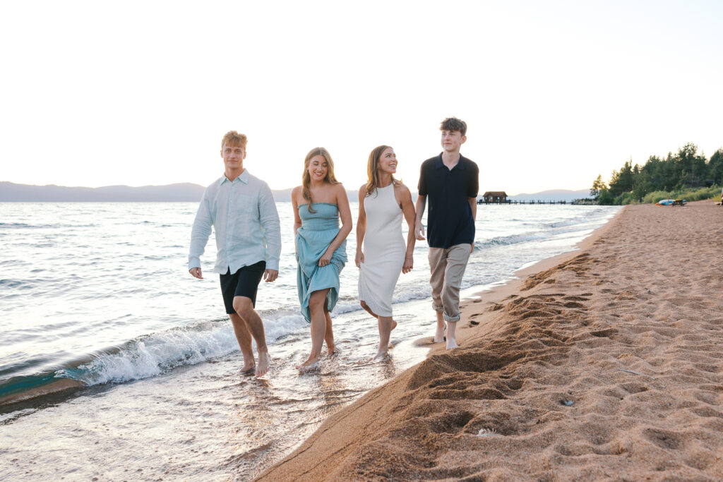 Family of four walking on Nevada Beach at sunset for a photography session with Simone Jaramillo Photography