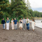 Walking with family on the beach shore of Lake Tahoe, Ca for a family session. Photo taken by Simone Jaramillo Photography